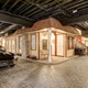 Illustration for article titled Theres Life-Sized Fake Town Complete With Real Cars In This Mansions Basement